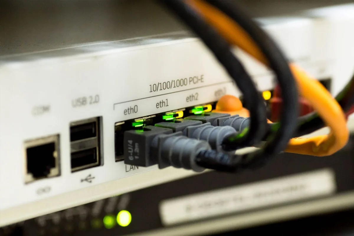 Network ports with cables connected and link lights lit