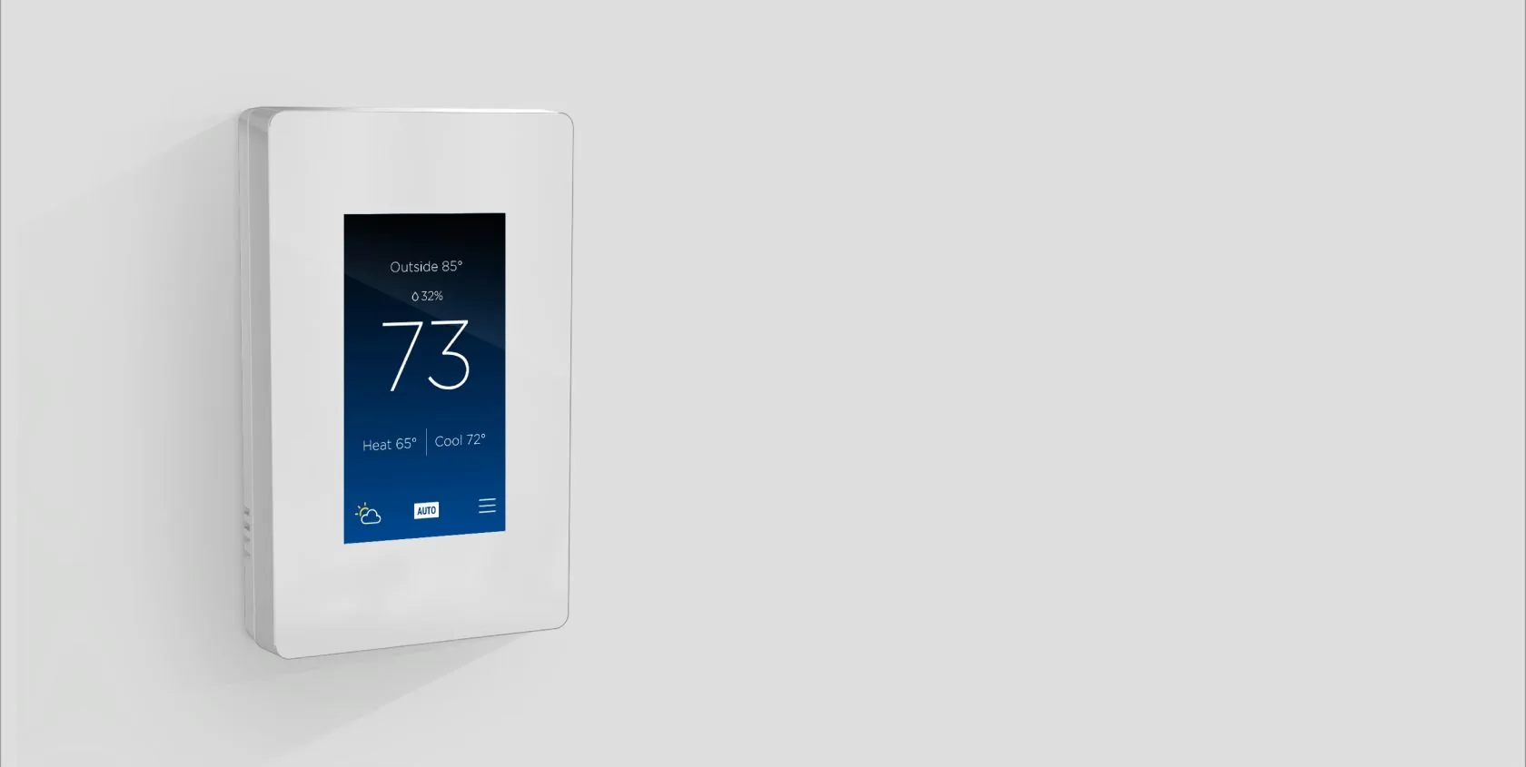 A white Savant Multistat thermostat on a pale wall showing 73 degrees