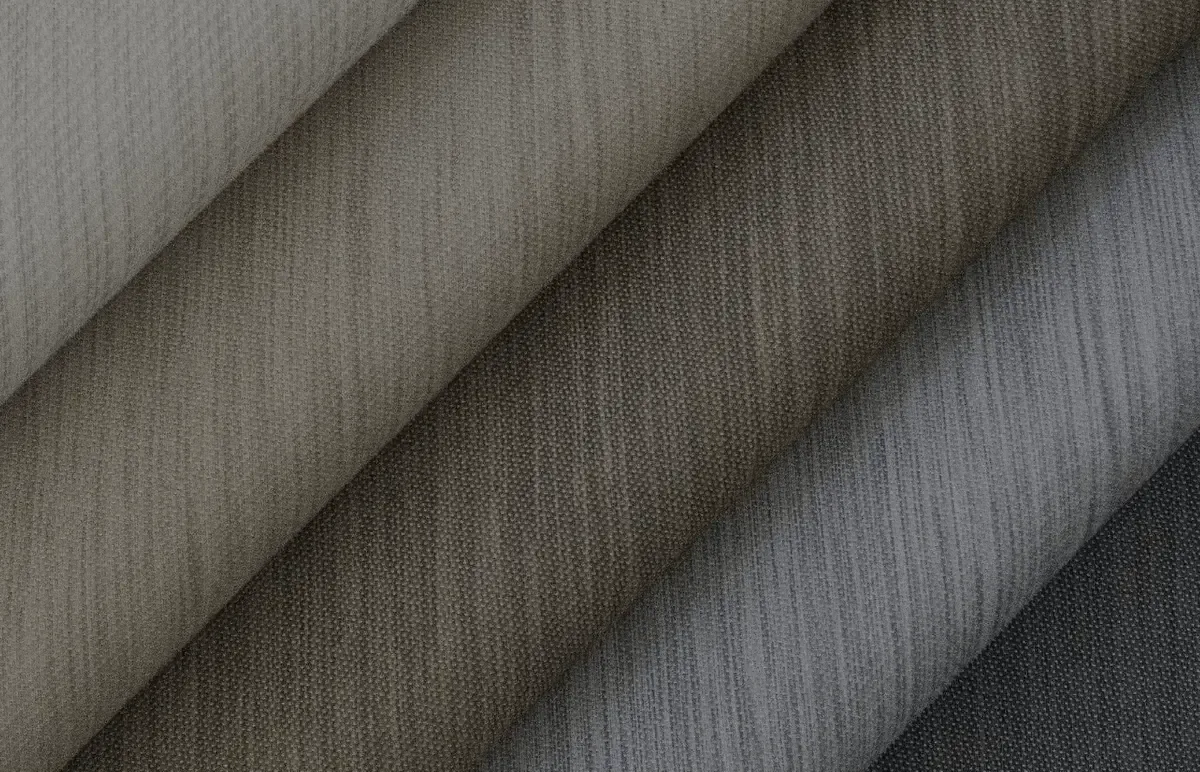 Folded Savant shade fabrics in warm neutral tones